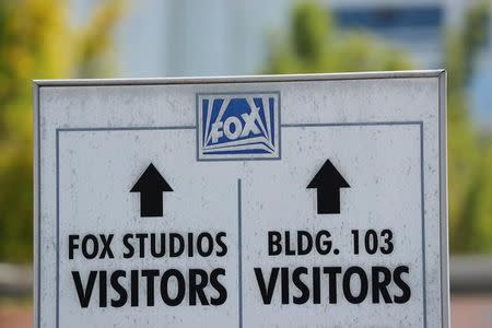 A sign pointing directions is shown at the entrance to Fox Studios in Los Angeles, California, U.S. June 13, 2018. REUTERS/Mike Blake