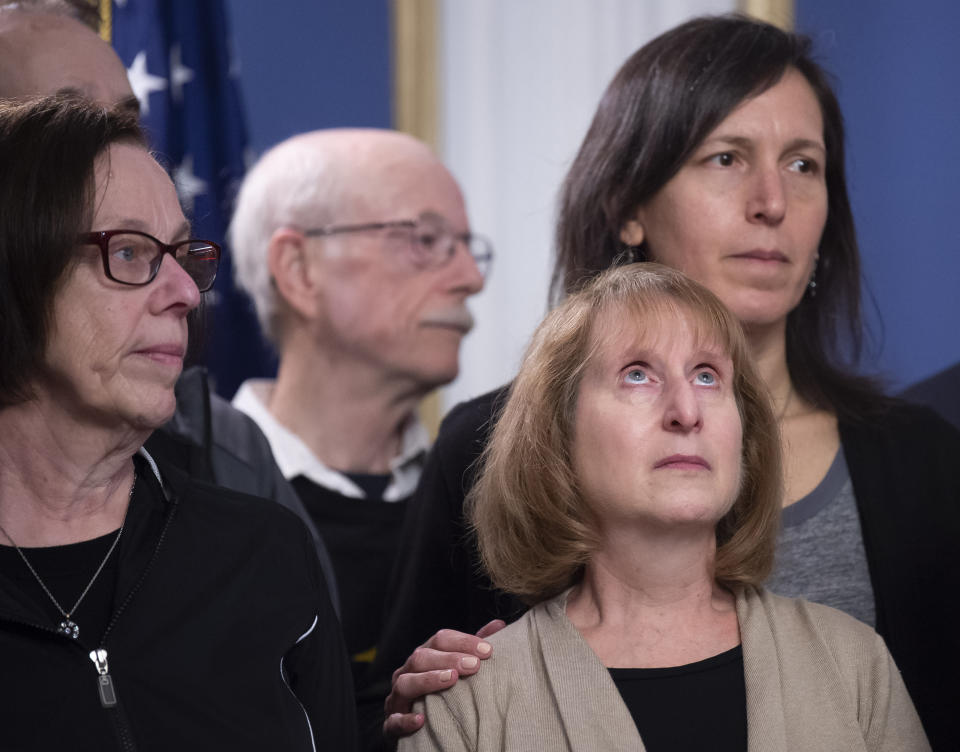 Family members Tree of Life synagogue shooting victims listen to Pittsburgh Mayor Bill Peduto after he signed three gun-control bills into law, Tuesday, April 9, 2019, at the City-County Building in downtown Pittsburgh. (Steph Chambers/Pittsburgh Post-Gazette via AP)