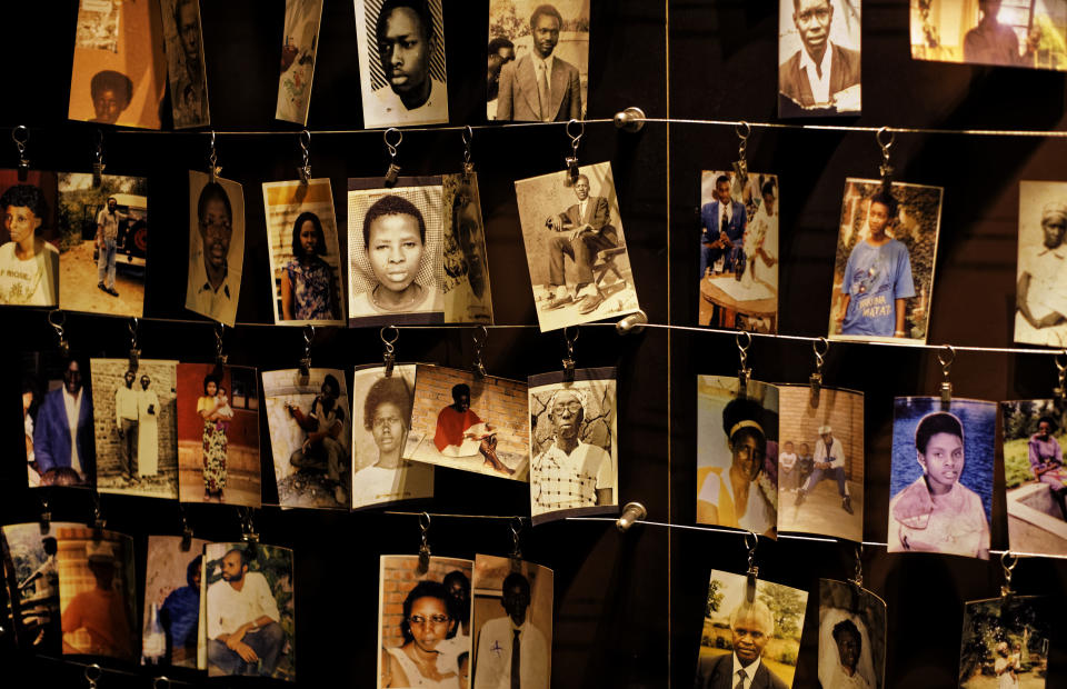 Family photographs of some of those who died hang on display in an exhibition at the Kigali Genocide Memorial centre in the capital Kigali, Rwanda Friday, April 5, 2019. Rwanda will commemorate on Sunday, April 7, 2019 the 25th anniversary of when the country descended into an orgy of violence in which some 800,000 Tutsis and moderate Hutus were massacred by the majority Hutu population over a 100-day period in what was the worst genocide in recent history. (AP Photo/Ben Curtis)