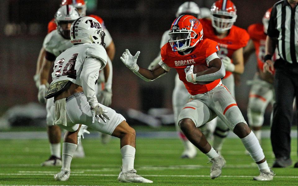 Jaedyn Gipson, right, rushes the ball for Central during a game against Legacy on Friday, Oct. 29, 2021.