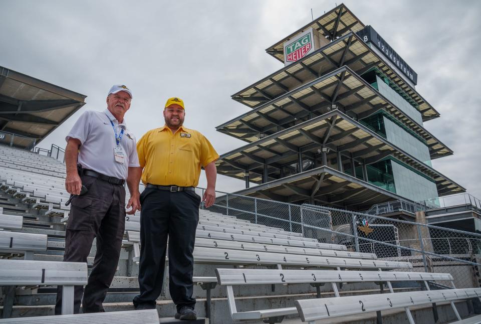 Dan Hagist (left) and son, Danny, have been yellow shirts at the track for several years. This will be Dan's 47th year and Danny's 16th year. Dan is in charge of all stands and mounds, while Danny takes care of the paddock area. The two pose for a portrait Friday, April 29, 2022, at Indianapolis Motor Speedway.