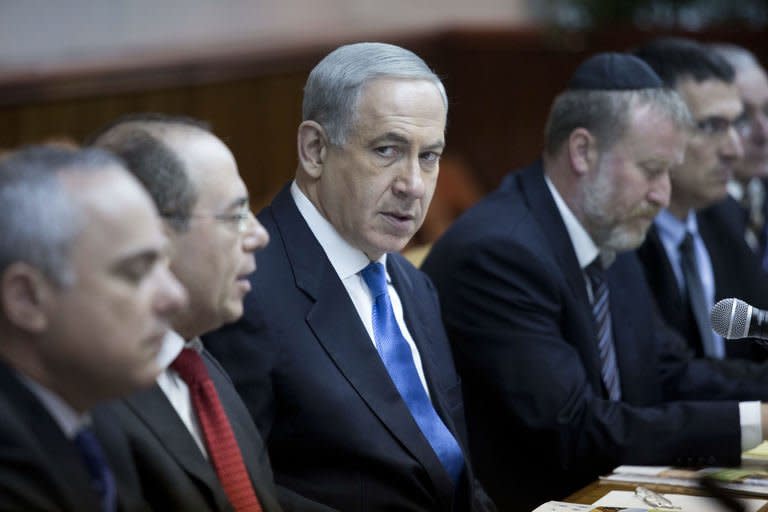 Israeli Prime Minister Benjamin Netanyahu looks over during the weekly cabinet meeting in his Jerusalem office, on July 14, 2013