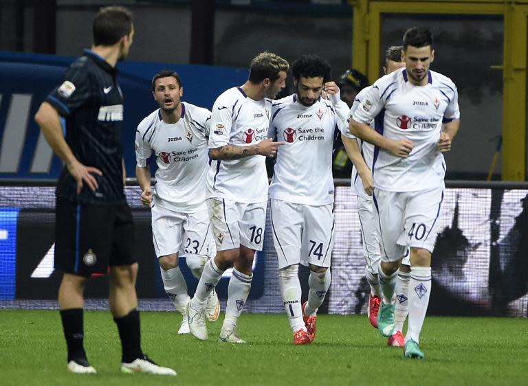 Fiorentina's midfielder Mohamed Salah (2-R) celebrates with teammates after scoring during the Italian Serie A football match Inter Milan vs Firentina on March 1, 2015