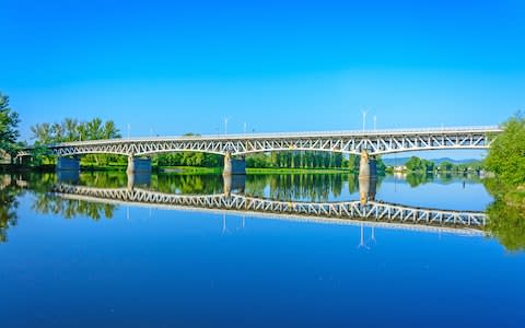 A steel bridge over the Labe River in the town of Litomerice in Czech Republic - Credit: istock