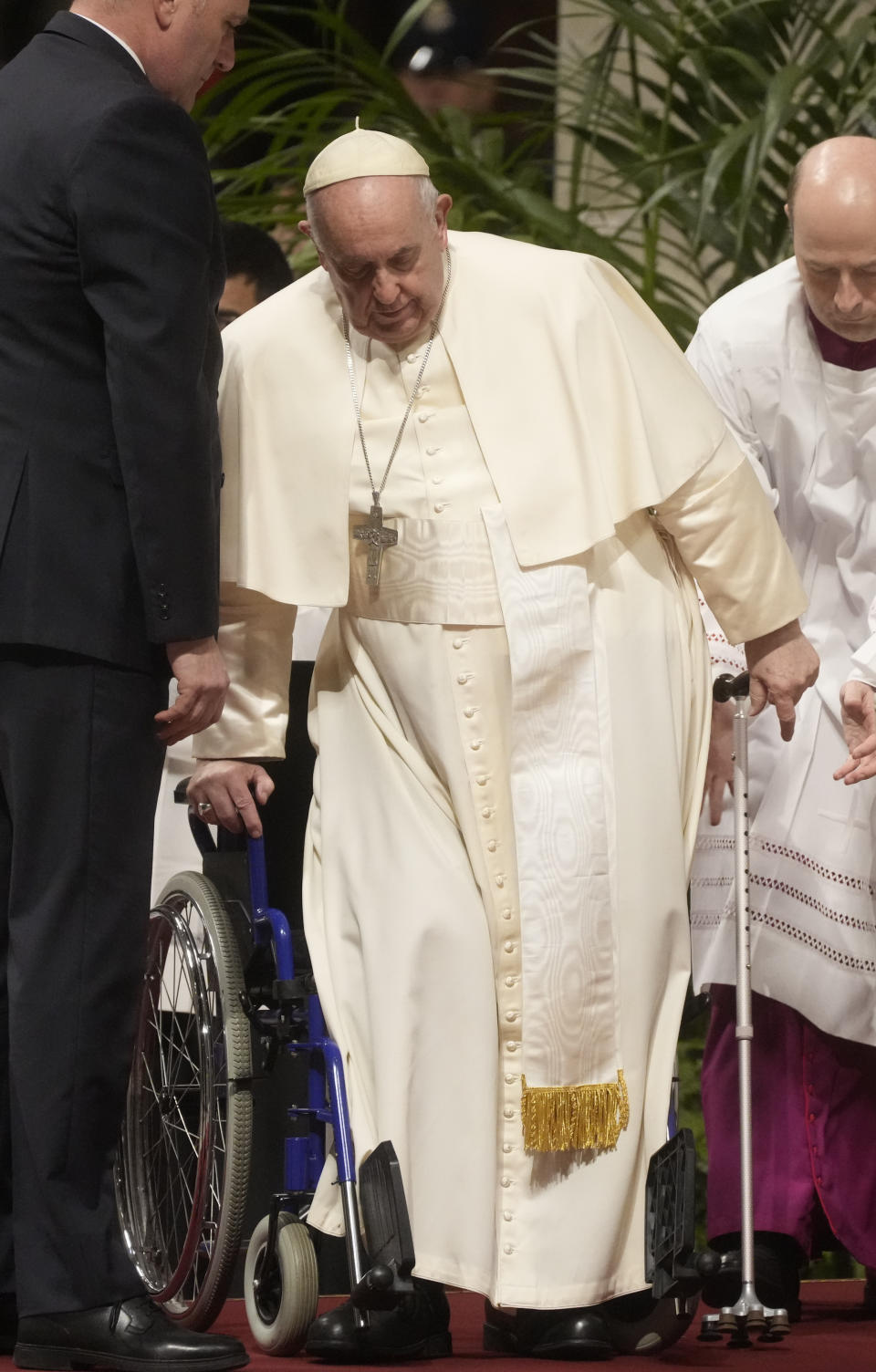 Pope Francis arrives in St. Peter's Basilica at The Vatican to preside over a mass in honor of our lady of Guadalupe, Monday, Dec. 12, 2022. (AP Photo/Gregorio Borgia)