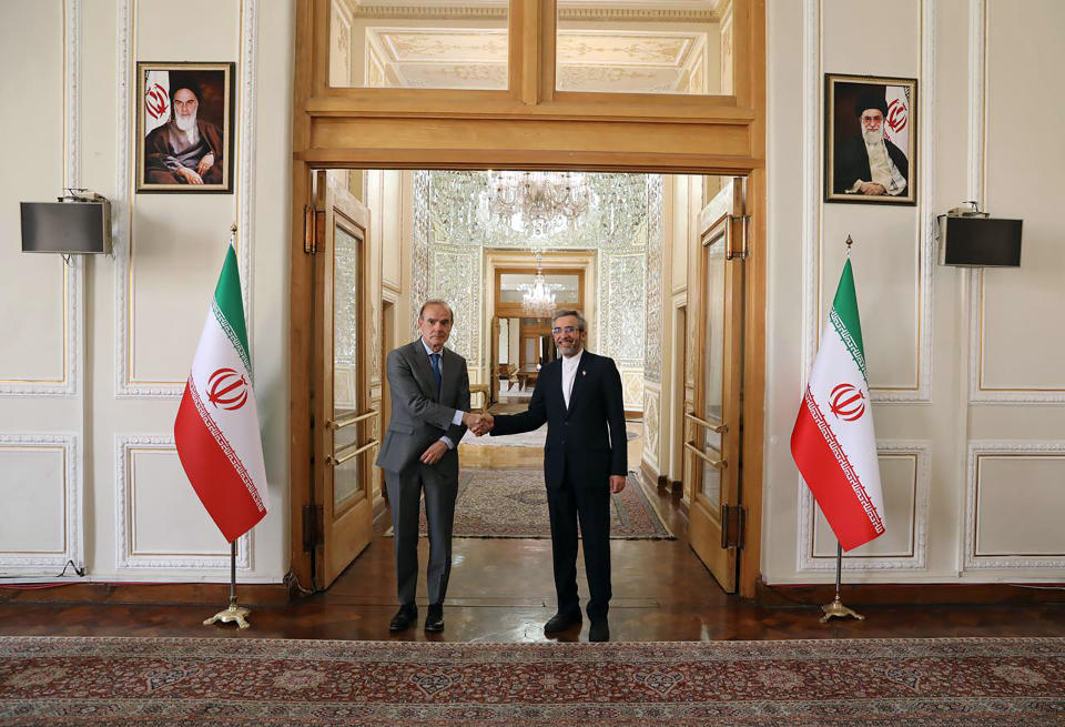 In this photo released by the Iranian Foreign Ministry, Enrique Mora, the European Union coordinator of talks to revive Iran's nuclear accord with world powers, left, shakes hands with Iran's top nuclear negotiator Ali Bagheri Kani, in Tehran, Iran, Wednesday, May 11, 2022. Mora traveled to Tehran as the bloc makes a last-ditch effort to salvage the tattered deal after a weekslong standstill. (Iranian Foreign Ministry via AP)