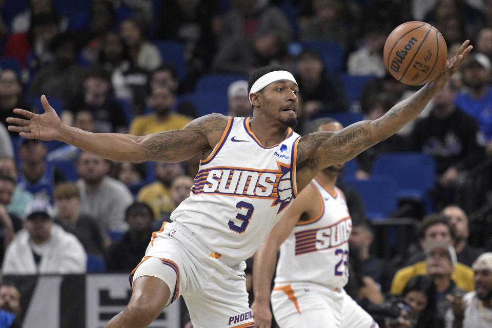 Phoenix Suns guard Bradley Beal (3) intercepts a pass during the first half of an NBA basketball game against the Orlando Magic, Sunday, Jan. 28, 2024, in Orlando, Fla. (AP Photo/Phelan M. Ebenhack)