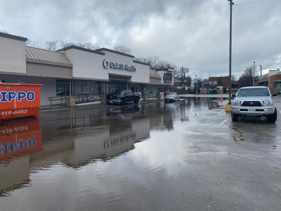 Some businesses at the Branch Avenue Plaza Shopping Center in Providence are open for business on Saturday morning, despite flooding in the parking lot that was 6 inches deep in spots. The shopping center was hit by extreme flooding last year that closed multiple businesses.