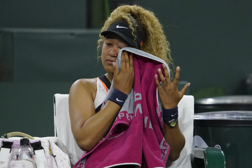 FILE - Naomi Osaka, of Japan, reacts to a comment from a spectator during her match against Veronika Kudermetova, of Russia, at the BNP Paribas Open tennis tournament, Saturday, March 12, 2022, in Indian Wells, Calif. Osaka is a four-time Grand Slam champion who helped spark a conversation about athletes’ mental health when she pulled out of last year’s French Open before her second-round match and revealed that she has dealt with anxiety and depression. (AP Photo/Mark J. Terrill, File)