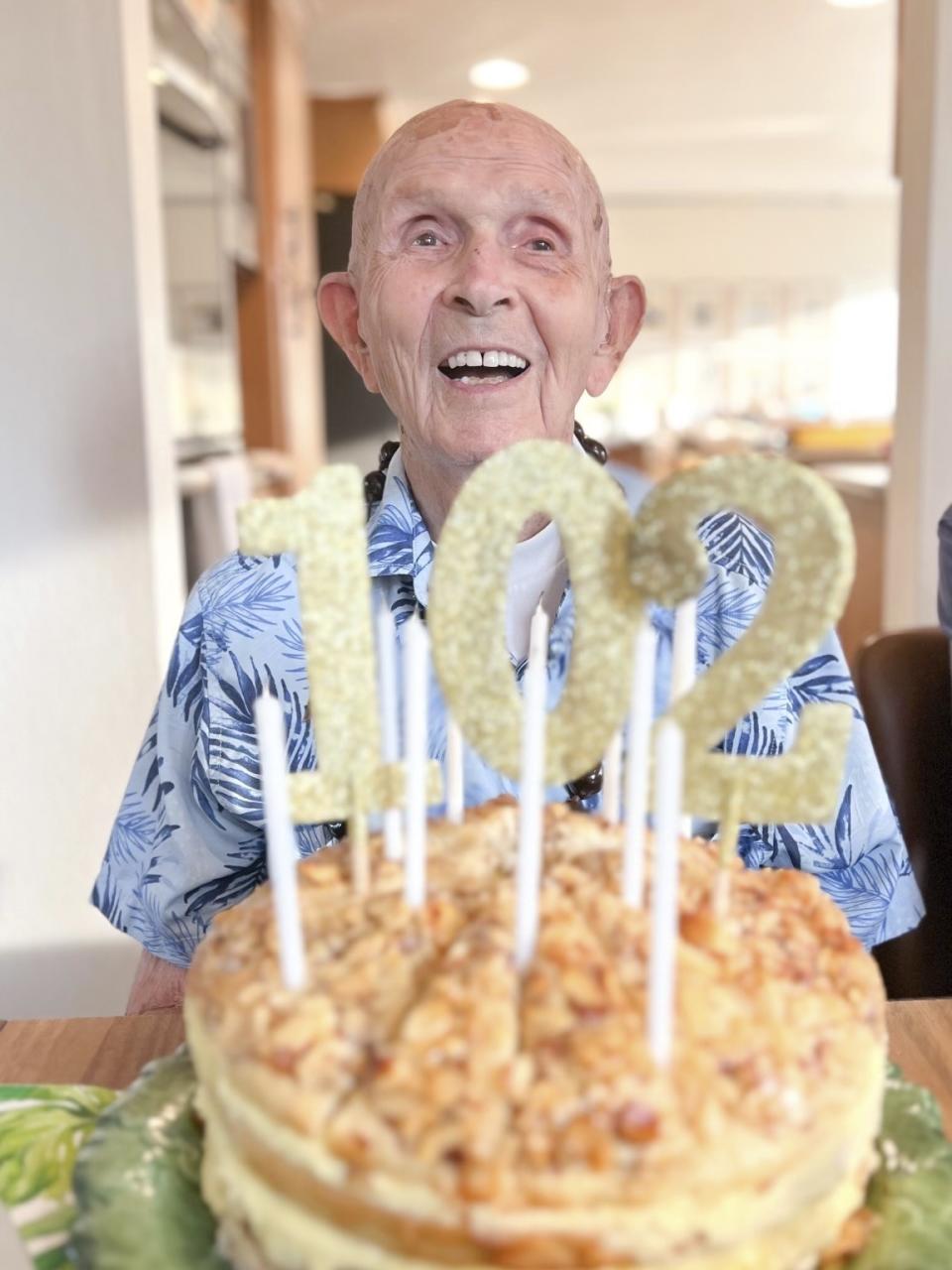 This photo provided by Angela Norton shows Pearl Harbor survivor Richard C. "Dick" Higgins in Bend, Ore., on his 102nd birthday on July 24, 2023. Higgins, one of the few remaining survivors of the Japanese attack on Pearl Harbor, died Tuesday, March 19, 2024, at his home in Bend, Ore. He was 102. (Angela Norton via AP)