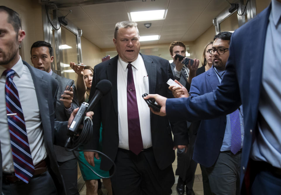 FILE--In this Sept. 18, 2018, file photo, Sen. Jon Tester, D-Mont., responds to reporters' questions on Supreme Court nominee Brett Kavanaugh on Capitol Hill in Washington, D.C. Tester's Republican opponent, Matt Rosendale, is accusing Tester, of obstructing the confirmation process of Kavanaugh. (Rachel Leathe/Bozeman Daily Chronicle via AP, FILE)
