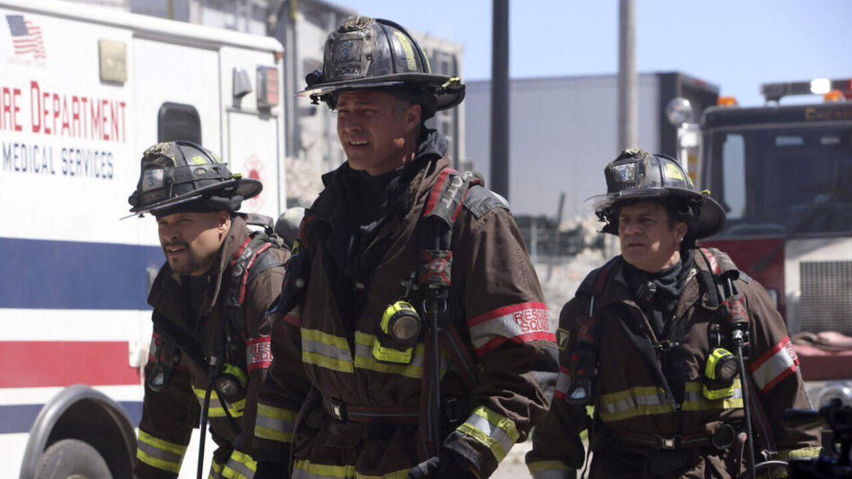  Taylor Kinney as Severide and Squad 3 on the scene of an accident in Chicago Fire Season 12x12. 