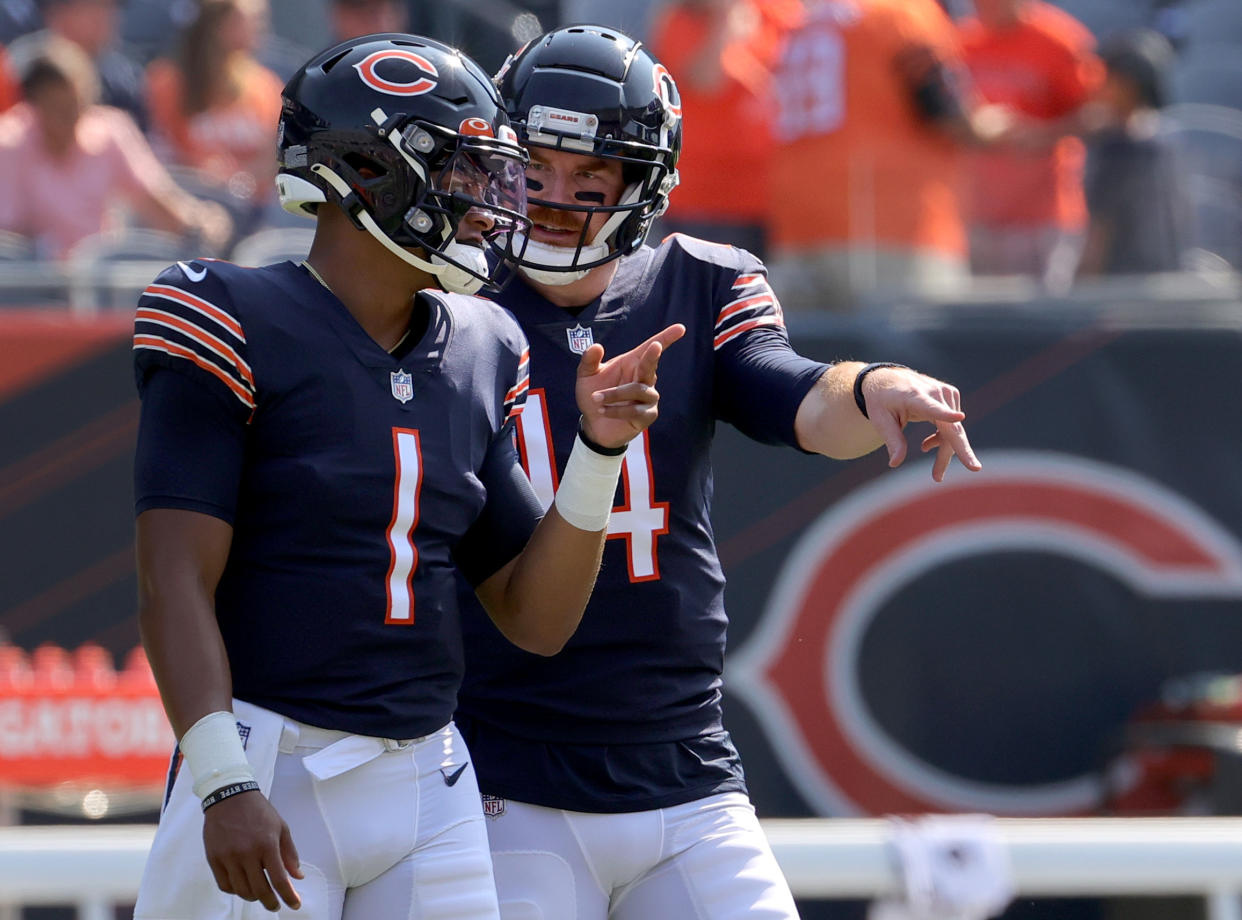 Justin Fields, left, took over from Andy Dalton, right, for the Chicago Bears on Sunday. (Photo by Jonathan Daniel/Getty Images)