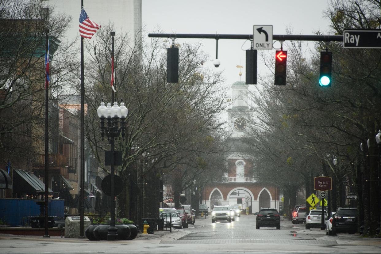 Rain starts coming down on Hay Street, Tuesday, Jan. 9, 2024.