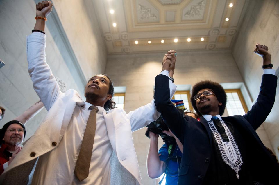 From left, Reps. Justin Jones, D-Nashville, and Justin Pearson, D-Memphis, meet with supporters at the Tennessee Capitol in Nashville on April 6, 2023.