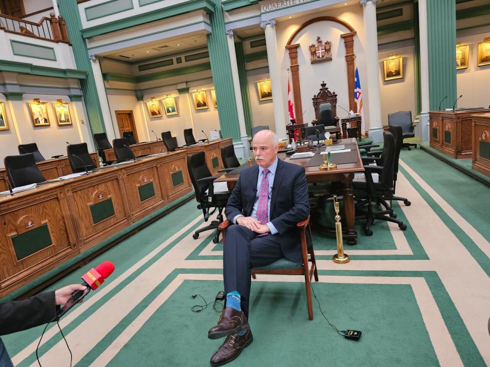 Osborne shared the news with members of the media as his family watched on inside the House of Assembly.