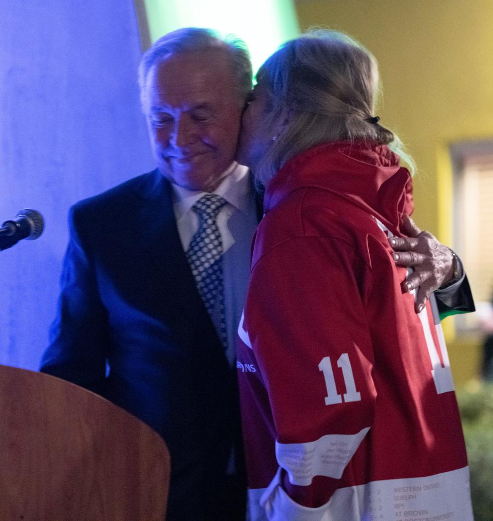 Florida Everblades general manager and former part owner Craig Brush is given a kiss by his wife Kyle as he is celebrated during a ceremony to unveil a plaque in his honor before the game against Trois-Rivieres at Hertz Arena in Estero Saturday night, December 4, 2021. Photo by Darron R. Silva/Special to the Naples Daily News