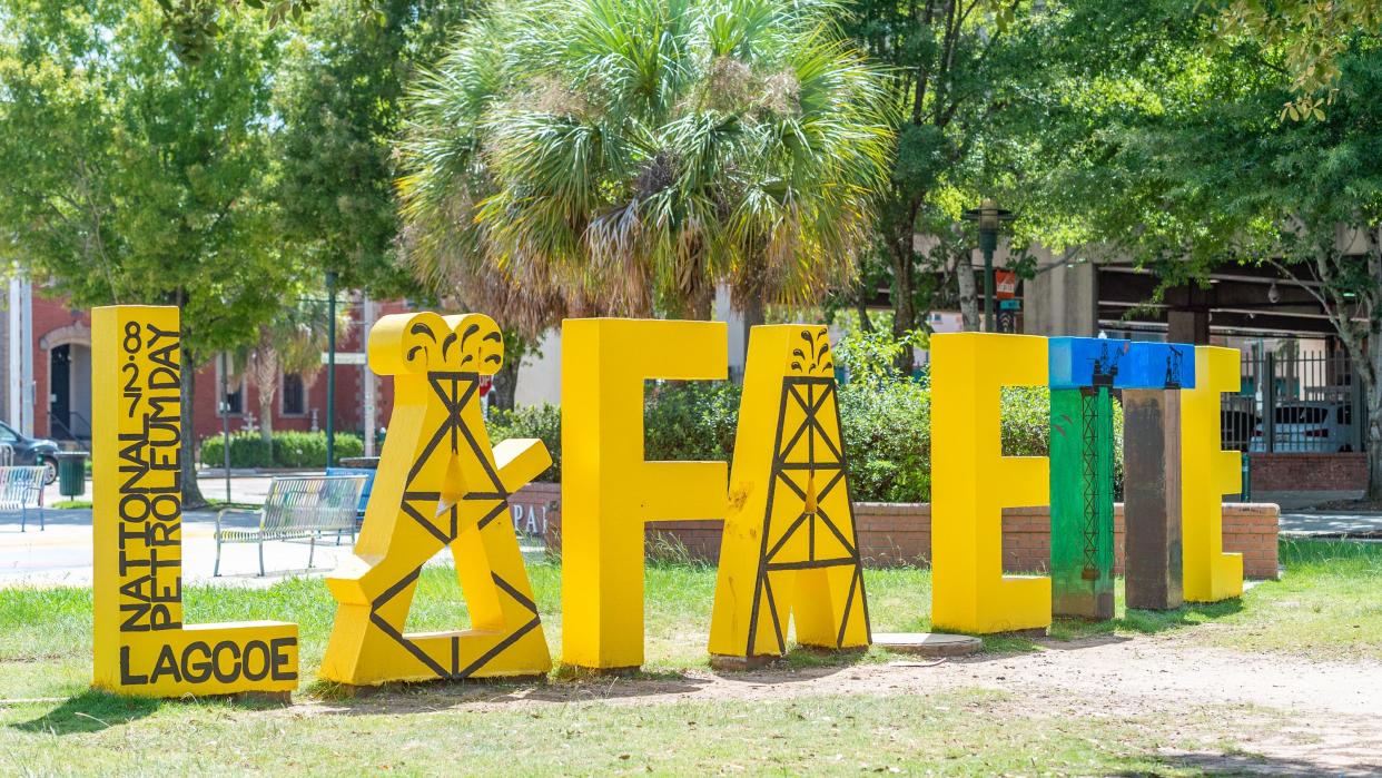 The Y Lafayette sign in downtown's Parc San Souci in honor of National Petroleum Day and to commemorate the rich history of the oil and gas industry in Acadiana. Monday, Aug. 17, 2020.