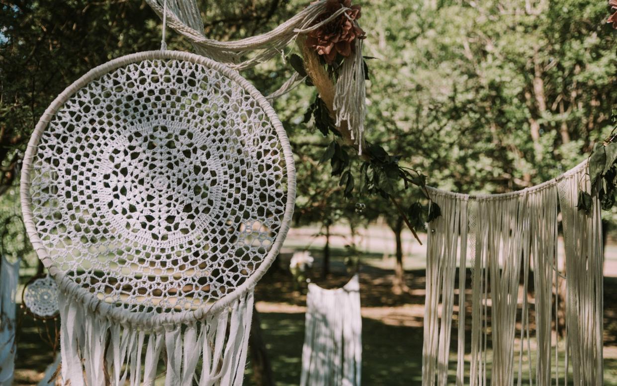 White dreamcatchers in a garden