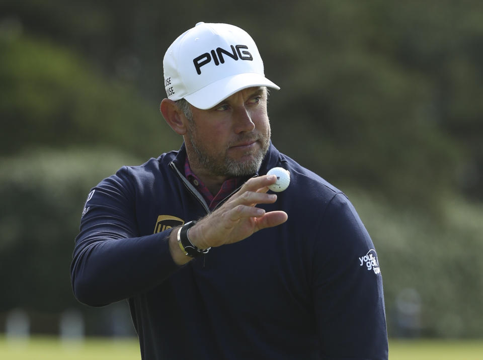 England's Lee Westwood acknowledges the crowd after getting a birdie on the 4th green during the third round of the British Open Golf Championships at Royal Portrush in Northern Ireland, Saturday, July 20, 2019.(AP Photo/Jon Super)