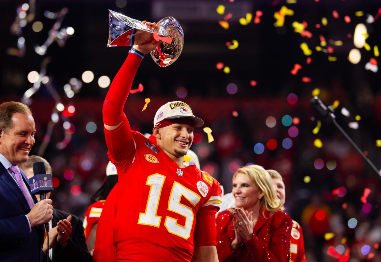 Kansas City Chiefs quarterback Patrick Mahomes (15) celebrates with the Vince Lombardi Trophy after defeating the San Francisco 49ers in overtime of Super Bowl 58 at Allegiant Stadium.