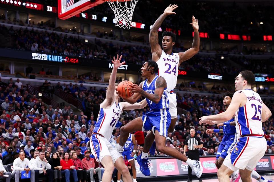 Kentucky’s Rob Dillingham (0) looks to make a play against Kansas in the Champions Classic in Chicago.