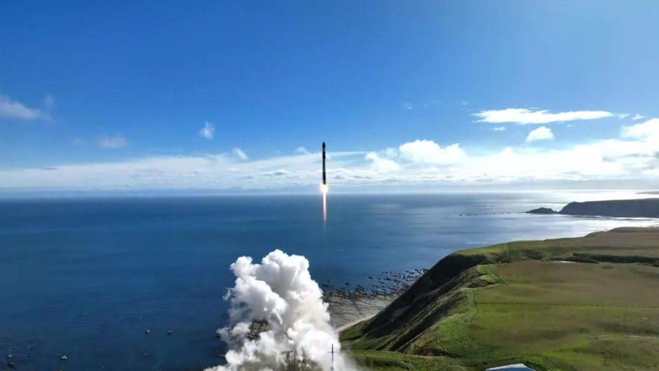 An Electron rocket blasts off from Rocket Lab's picturesque Mahia, New Zealand, launch site, carrying two small NASA satellites designed to monitor tropical storm development. / Credit: Rocket Lab