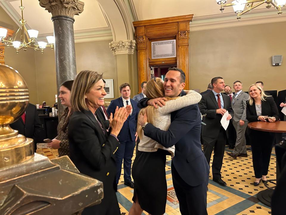 Senate President Amy Sinclair hugs school choice activist Corey DeAngelis after the passage of Gov. Kim Reynolds’ private school scholarship proposal.