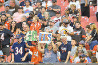 Chicago Bears fans celebrate after their team scored a touchdown against the Cleveland Browns during the first half of an NFL preseason football game, Saturday, Aug. 27, 2022, in Cleveland. (AP Photo/David Richard)