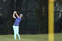 Paul Peterson of the United States plays follows his swing on the 2nd hole at the Malaysia Golf Championship Round 2 in Kuala Lumpur, Malaysia, Friday, March 22, 2019. (AP Photo/Vincent Phoon)