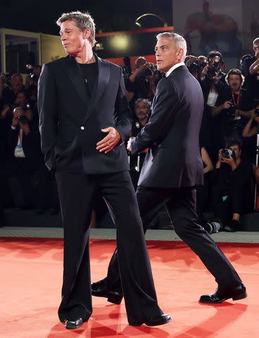 <p>Vittorio Zunino Celotto/Getty</p> Brad Pitt and George Clooney in 2024