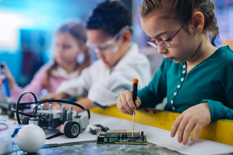 Group of kids working in laboratory