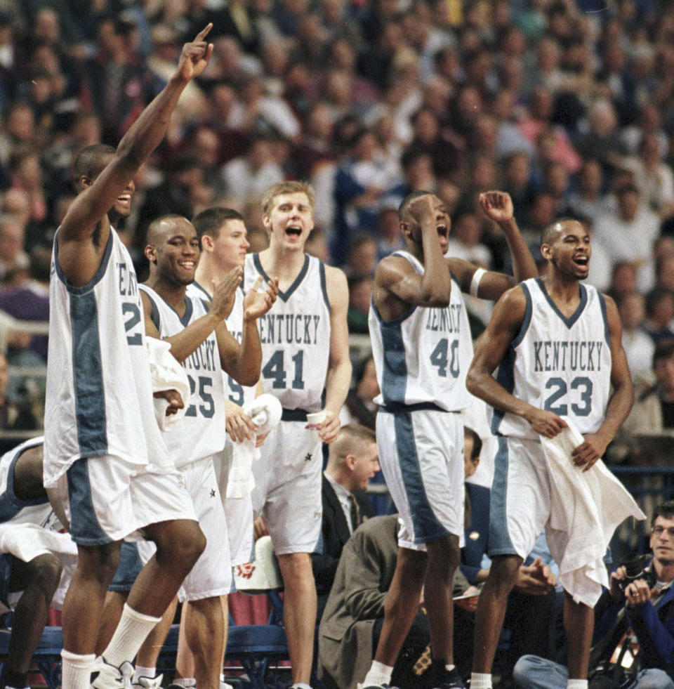 FILE - Kentucky players celebrates in the final moments of their 101-70 win over Utah at the NCAA college basketball Midwest Regionals in Minneapolis, March 21, 1996. From left are: Antoine Walker (24), Anthony Epps (25) Jeff Shepard (15), Mark Pope (41), Walter McCarty (40) and Derek Anderson (23). (AP Photo/Jim Mone, File)