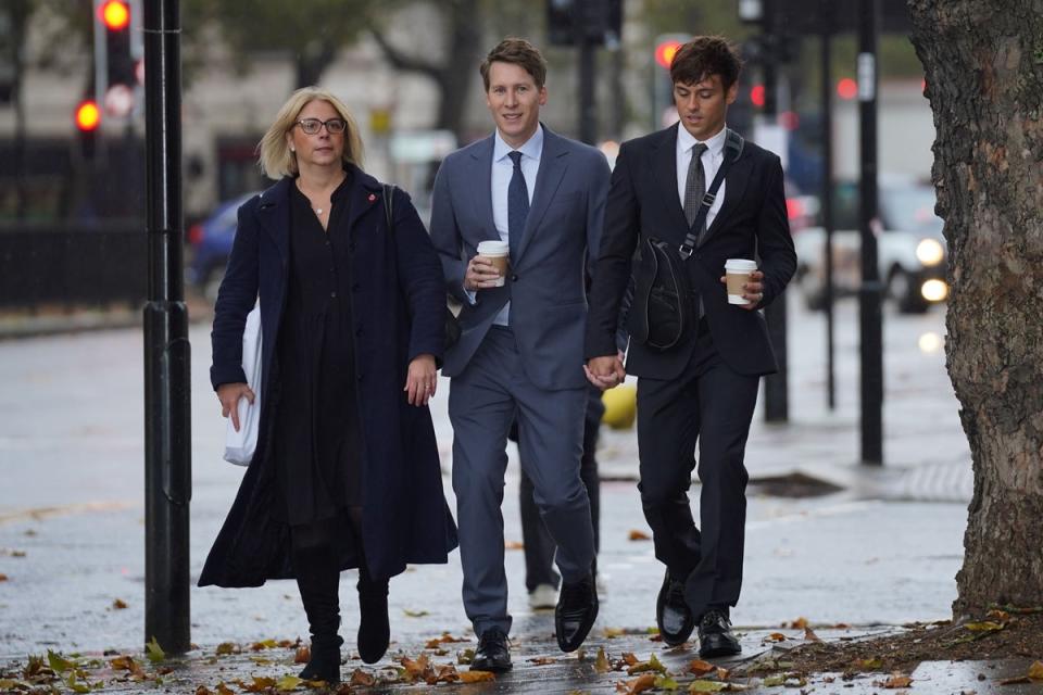 Dustin Lance Black, centre,  (Lucy North/PA) (PA Wire)
