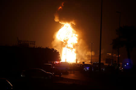 Emergency and rescue workers are seen blocking the road leading to a fire in at oil pipeline in Buri village south of Manama, Bahrain, November 10, 2017. REUTERS/Hamad I Mohammed