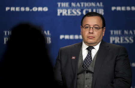 Ali Rezaian, brother of Washington Post reporter Jason Rezaian, talks to a reporter during a television interview at The National Press Club in Washington May 26, 2015. REUTERS/Carlos Barria