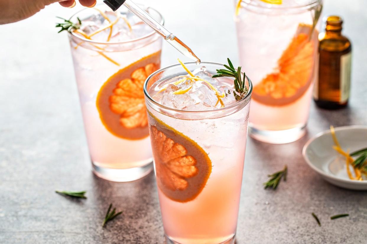 Putting Bitters into Grapefruit Rosemary Cocktail