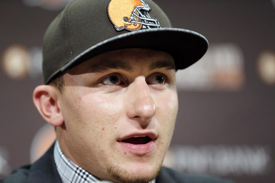 Cleveland Browns quarterback Johnny Manziel answers questions at his introductory news conference at the NFL football team's facility in Berea, Ohio, Friday, May 9, 2014. The Browns selected Manziel with the 22nd overall pick in the first round of the NFL draft. (AP Photo/Tony Dejak)