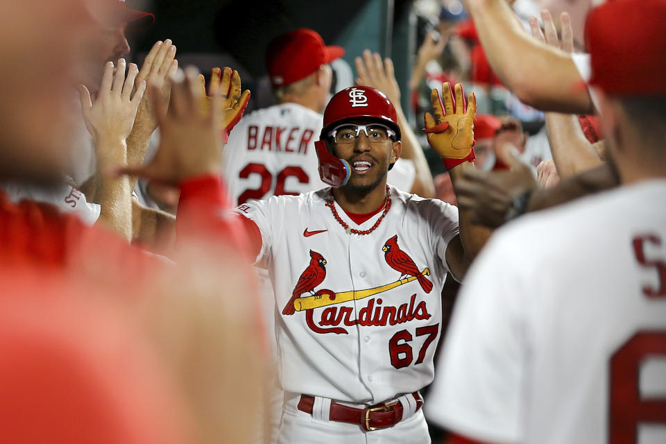 St. Louis Cardinals' Richie Palacios is congratulated by teammates after after hitting a two-run home run during the third inning of a baseball game against the Cincinnati Reds, Friday, Sept. 29, 2023, in St. Louis. (AP Photo/Scott Kane)