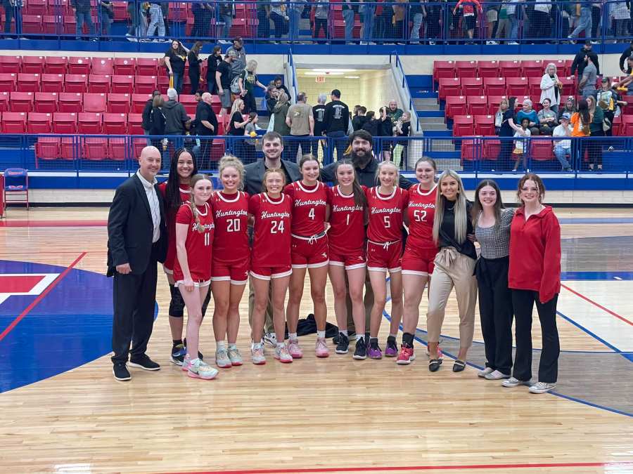 The Devilettes before the regional game with coaches and staff.