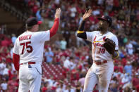 St. Louis Cardinals' Jordan Walker (18) and third base coach Ron 'Pop' Warner celebrate a 6-4 victory over the Pittsburgh Pirates in a baseball game Sunday, Sept. 3, 2023, in St. Louis. (AP Photo/Jeff Roberson)