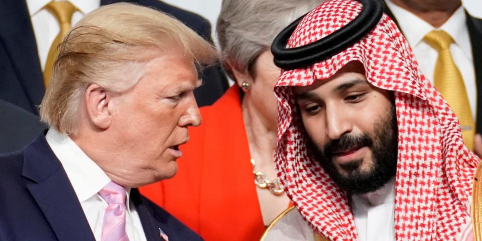 FILE PHOTO: U.S. President Donald Trump speaks with Saudi Arabia's Crown Prince Mohammed bin Salman during family photo session with other leaders and attendees at the G20 leaders summit in Osaka, Japan, June 28, 2019. REUTERS/Kevin Lamarque/File Photo