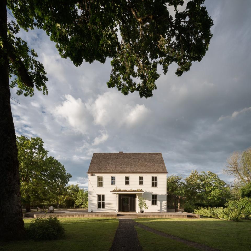 Wild Goose Farmhouse, pictured from under an oak tree, is where interior designer Jessica Helgerson and architect Yianni Doulis live with their two children, Max and Penelope. “When we were designing the house, we decided to give it a spirit, to help guide design decisions,” Helgerson says. “We created a character—a slightly forbidding spinster aunt, tall, thin, always dressed in starched linen dresses with high collars. She dies, and as you are going through her things, you discover a drawer full of fabulously beautiful lingerie and a bundle of letters from a Moroccan lover. She is the spirit of Wild Goose Farmhouse.”