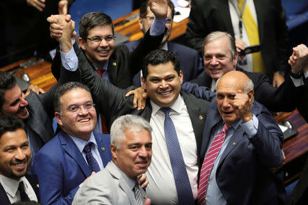 Davi Alcolumbre, from the Democratas party is congratulated by his colleagues after being elected for presidency of Brazilian senate in Brasilia, Brazil February 2, 2019. Fabio Rodrigues Pozzebom/Agencia Brasil/Handout via REUTERS