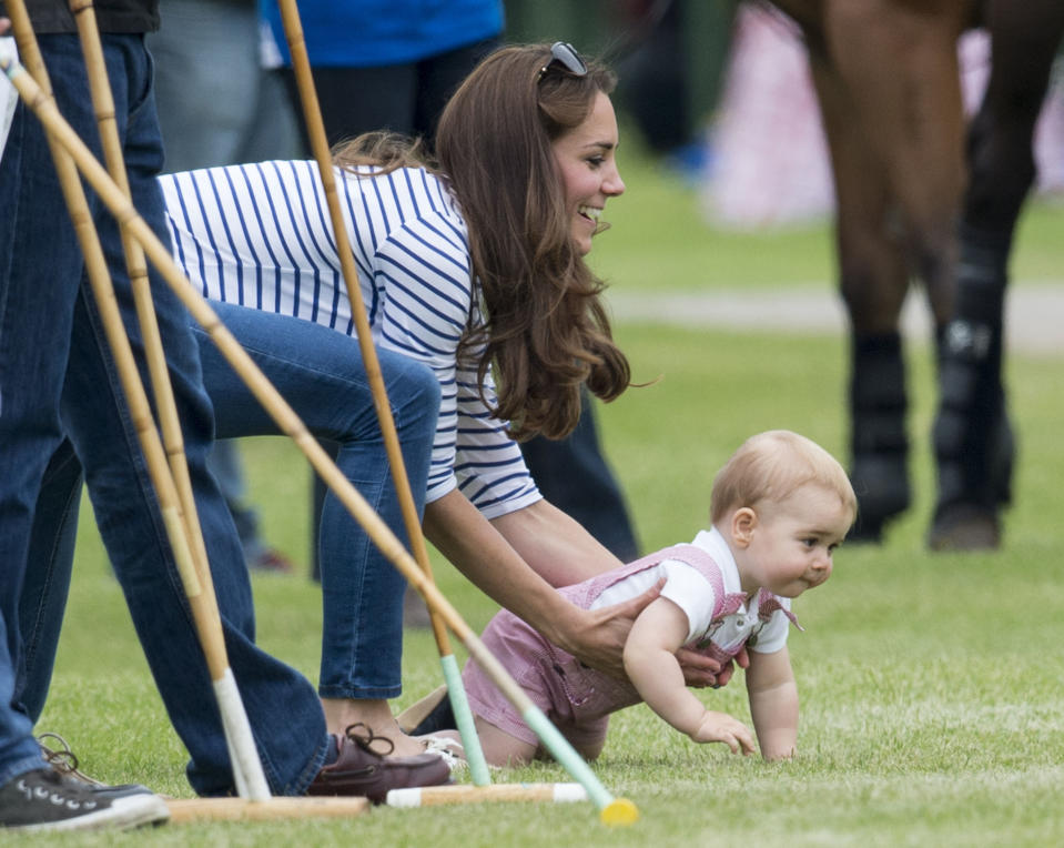 <p>The Duchess of Cambridge was running around after a little Prince George a the Jerudong Park Trophy at Cirencester Park Polo Club in 2014. (Mark Cuthbert/UK Press via Getty Images)</p> 