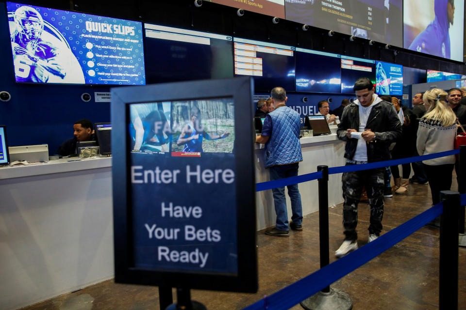 People make their bets at the FANDUEL sportsbook during the Super Bowl LIII in East Rutherford, New Jersey, February 3, 2019. REUTERS/Eduardo Munoz