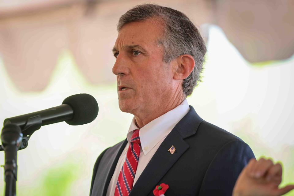Gov. John Carney gives remarks during a Memorial Day ceremony Monday, May 30, 2022, at War Memorial Plaza near New Castle.