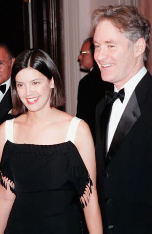 <p>Arnaldo Magnani/Getty</p> Phoebe Cates and Kevin Kline