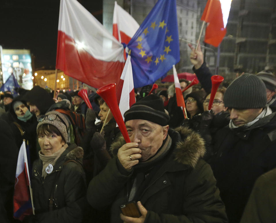 Anti-government activists attend a demonstration to mark the 35th anniversary of the marshal law in Warsaw, Poland, Tuesday, Dec. 13, 2016. (AP Photo/Czarek Sokolowski)