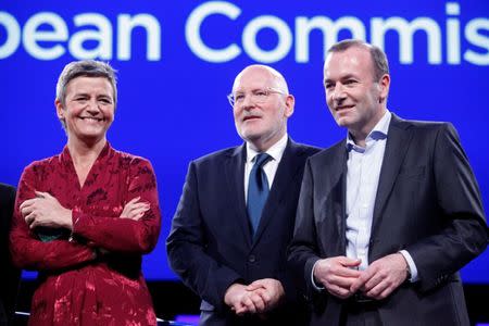 Margrethe Vestager of the Alliance of Liberals and Democrats for Europe (ALDE), Frans Timmermans of the Party of European Socialists (PES) and Manfred Weber of the European People's Party (EPP) pose for a group photo before a debate in the European Parliament, ahead of the May 23-26 elections for EU lawmakers, in Brussels, Belgium May 15, 2019. REUTERS/Francois Walschaerts